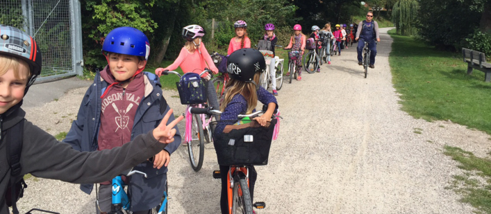 Line of children cycling